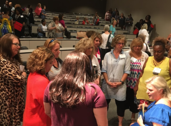 people gathered in a cluster talking